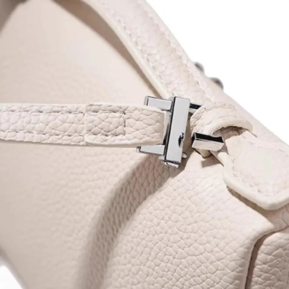 Beige lychee-grain shoulder bag with silver hardware, compact mini crossbody style