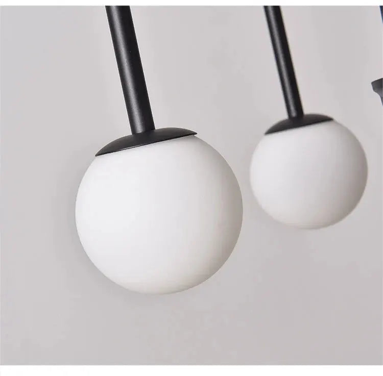Nordic minimalist pendant light with 2 white globe bulbs on black stems, modern living room cafe chandelier