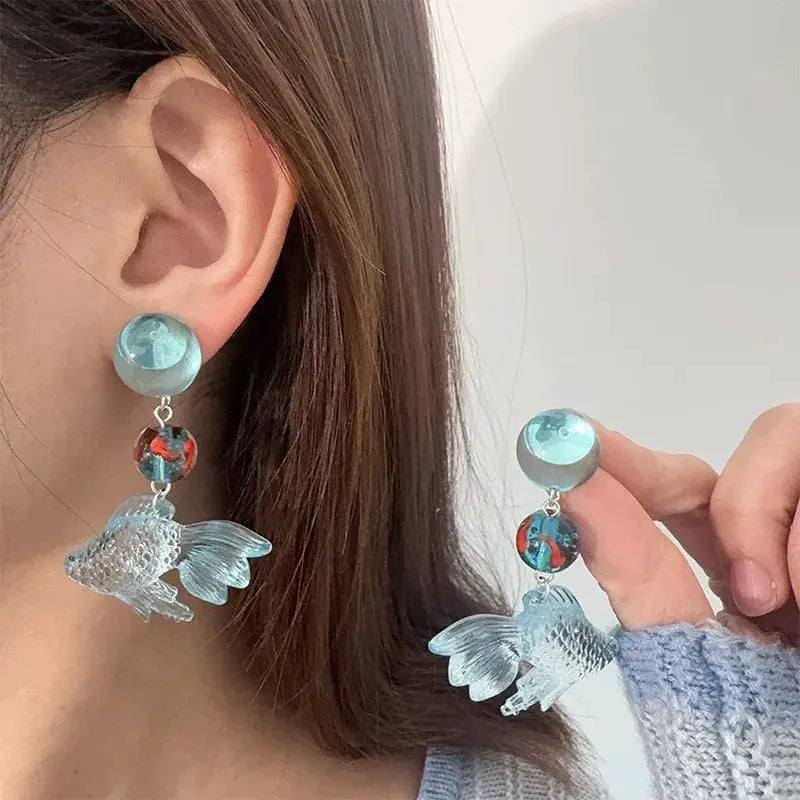 Pair of blue transparent goldfish drop earrings with koi bead accents and dangling fish charms