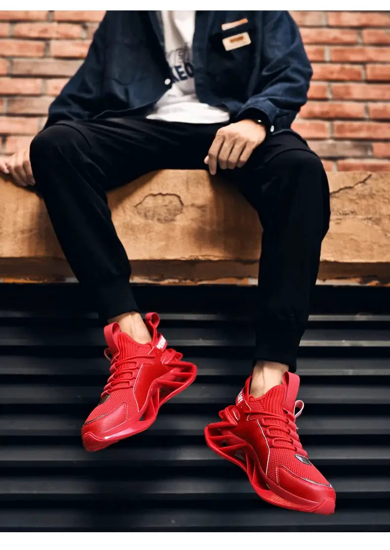 Men's red knit upper athletic sneakers with a chunky sculpted sole.