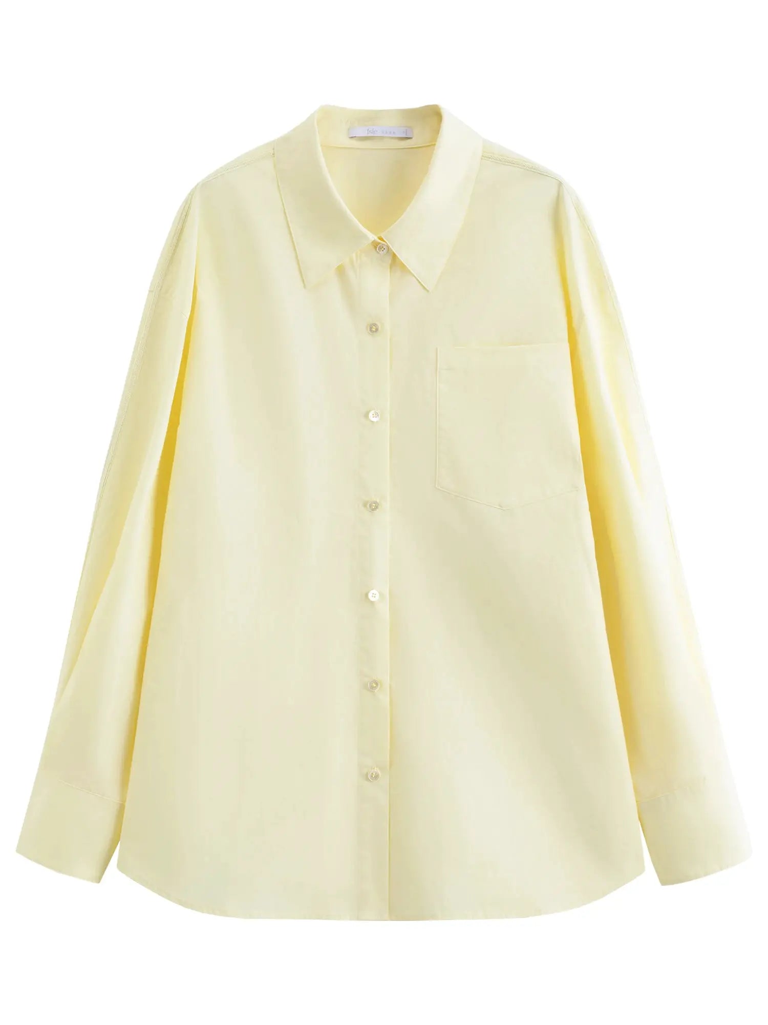 Oversized pale yellow cotton shirt with front button closure and chest pocket