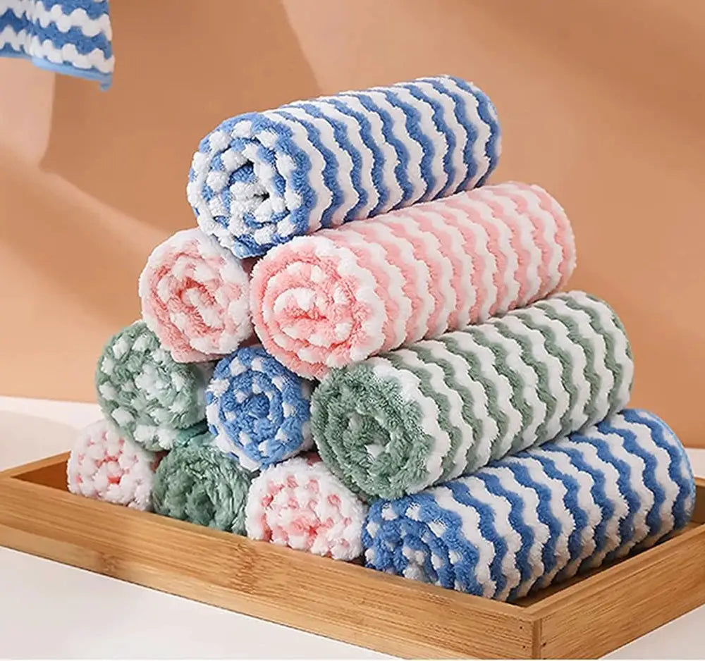 Velvet-thickened microfiber cleaning cloths, pastel striped rolls stacked on a wooden tray