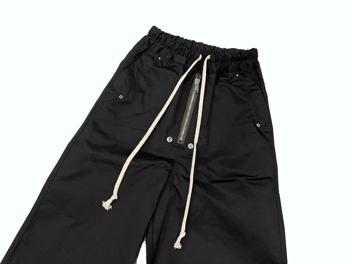 Owen Seak black men's cargo pants with elastic waistband, beige drawstrings, zip pockets