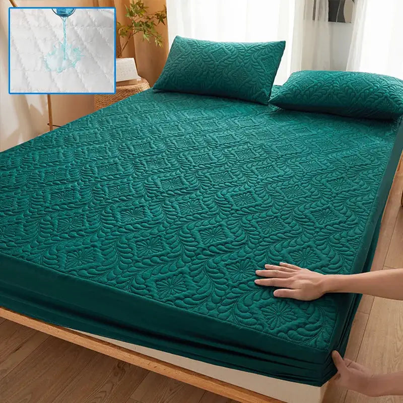 Simples Market teal waterproof quilted mattress protector, fitted cover with quilted pattern and two teal pillows.