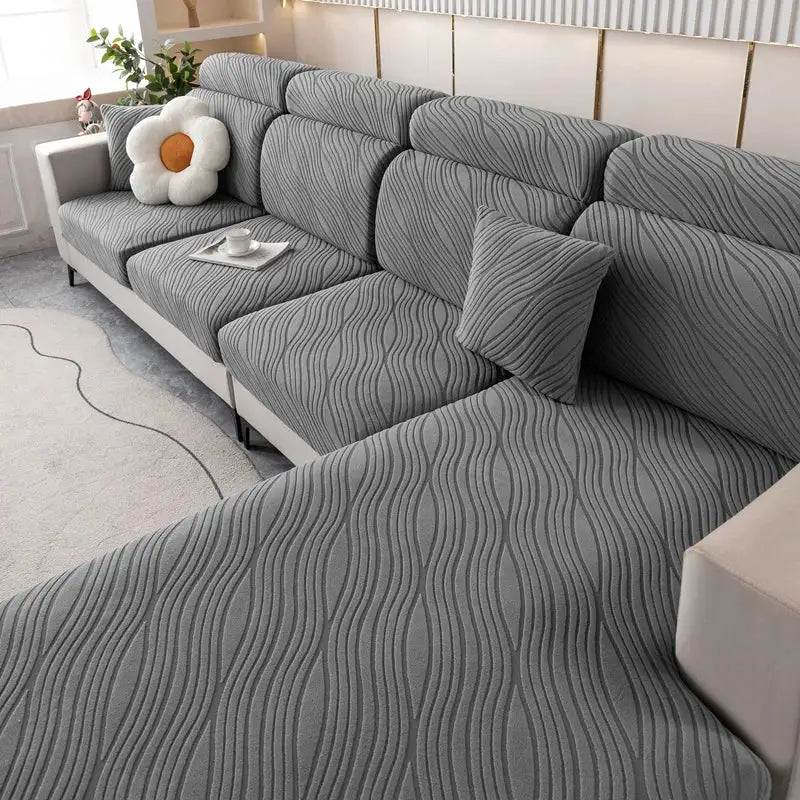 Simples Market sofa cushion covers; elastic gray wave-pattern fabric on a sectional sofa.