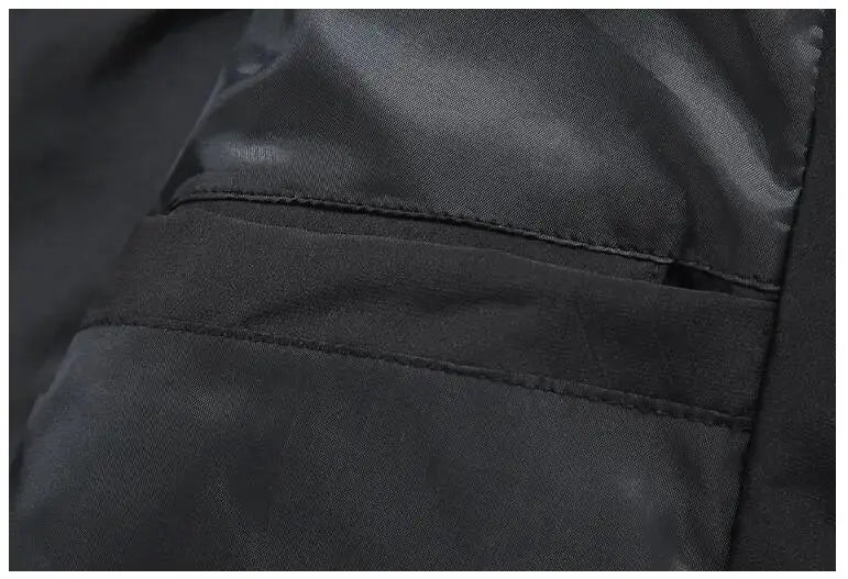 Simples Market men's black puffer jacket, close-up of pocket seam detail