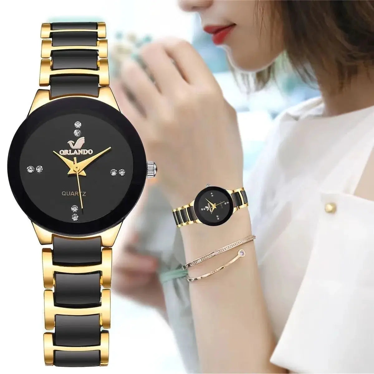 Fashion rhinestone women's watch by Orlando with gold-tone and black stainless steel band, analog quartz.