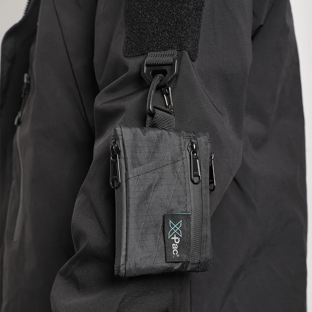Simples Market EDC 5-Pocket X-PAC multi-wallet with YKK zippers, clipped to a black jacket