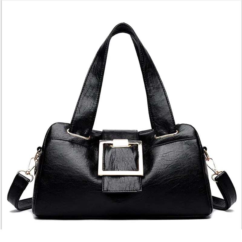 Women’s black leather top-handle bag with gold square buckle and detachable shoulder strap