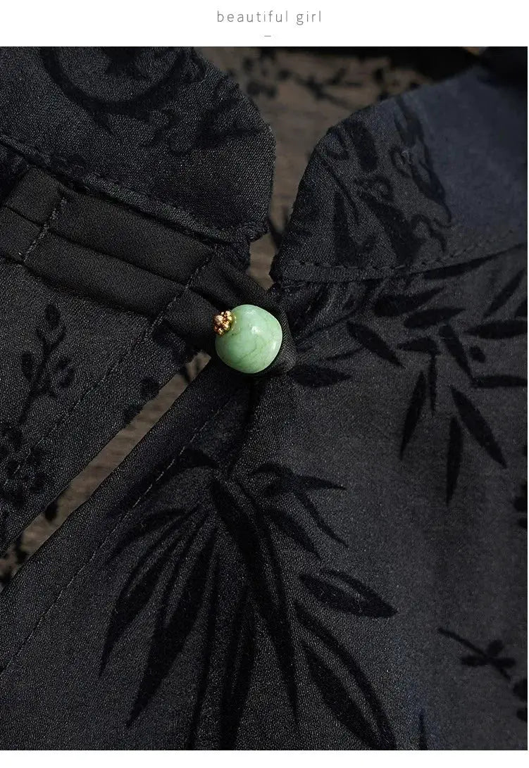Cheongsam top by Simples Market in black jacquard with green bead button accent.