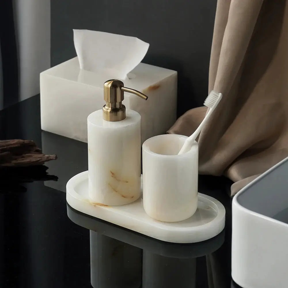 White onyx marble 3-piece bathroom set with soap dispenser, toothbrush cup, and tissue box on a matching vanity tray