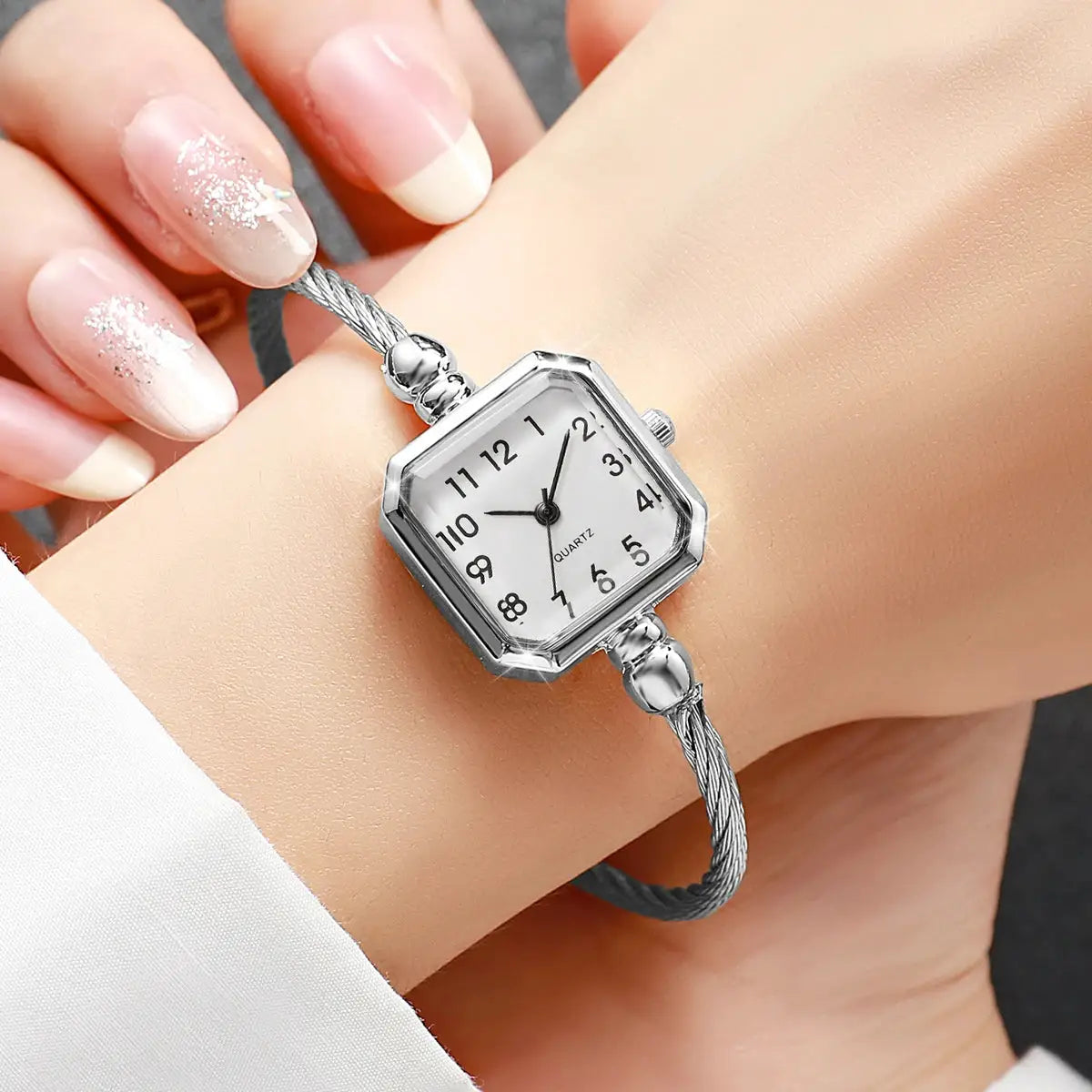 Women's square Roma-dial quartz wristwatch with silver bracelet strap