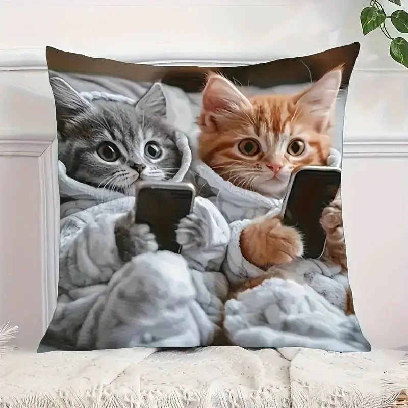 Pillow cover with two kittens (gray & orange) holding smartphones in a cozy blanket, Bohemian style, Simples Market