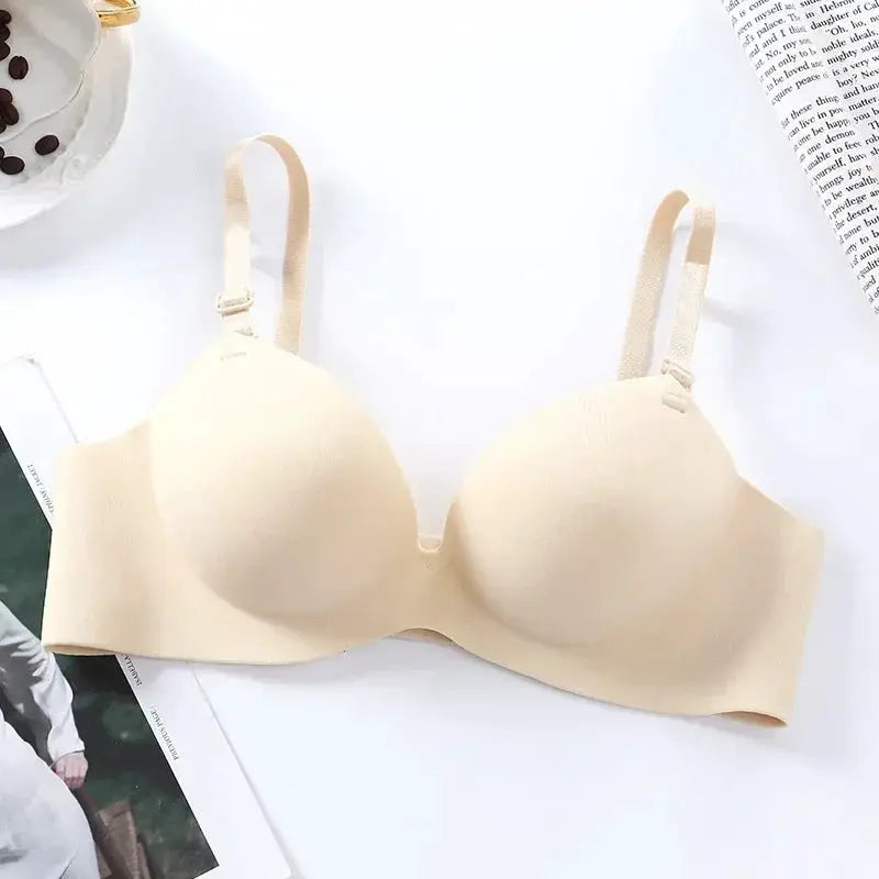 Women's seamless wireless bra in nude beige with molded cups and adjustable straps