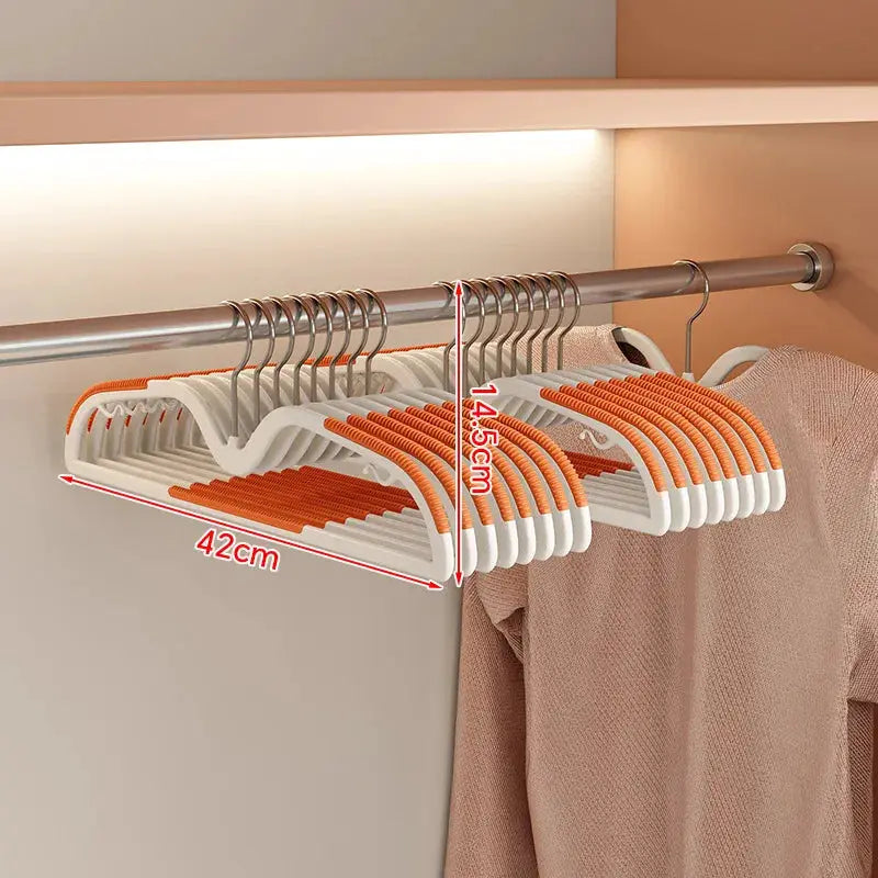 Short neck non-slip clothes hangers with white bodies and orange grips for space-saving closet organization
