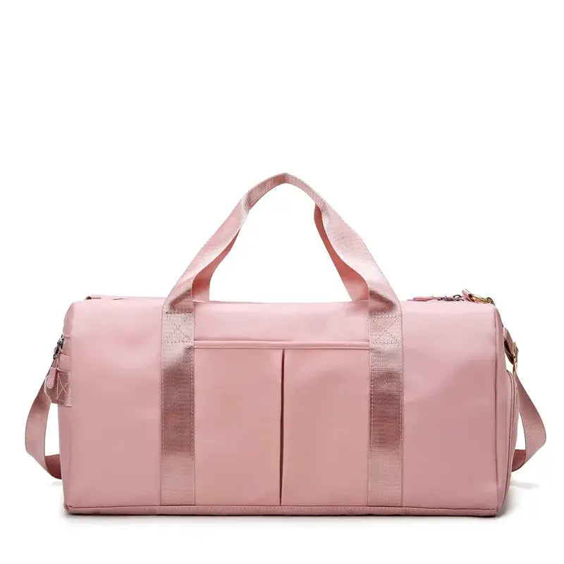 Pink fitness duffel bag with dual handles and shoulder strap; large-capacity travel gym bag.
