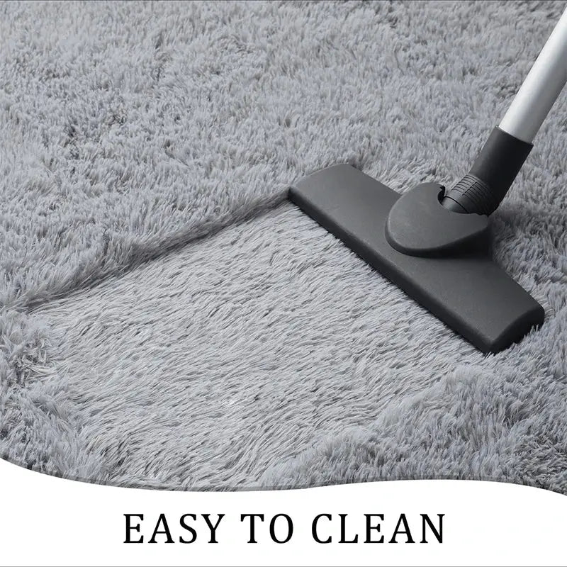 VIKAMA gray shag area rug with plush fibers being vacuumed