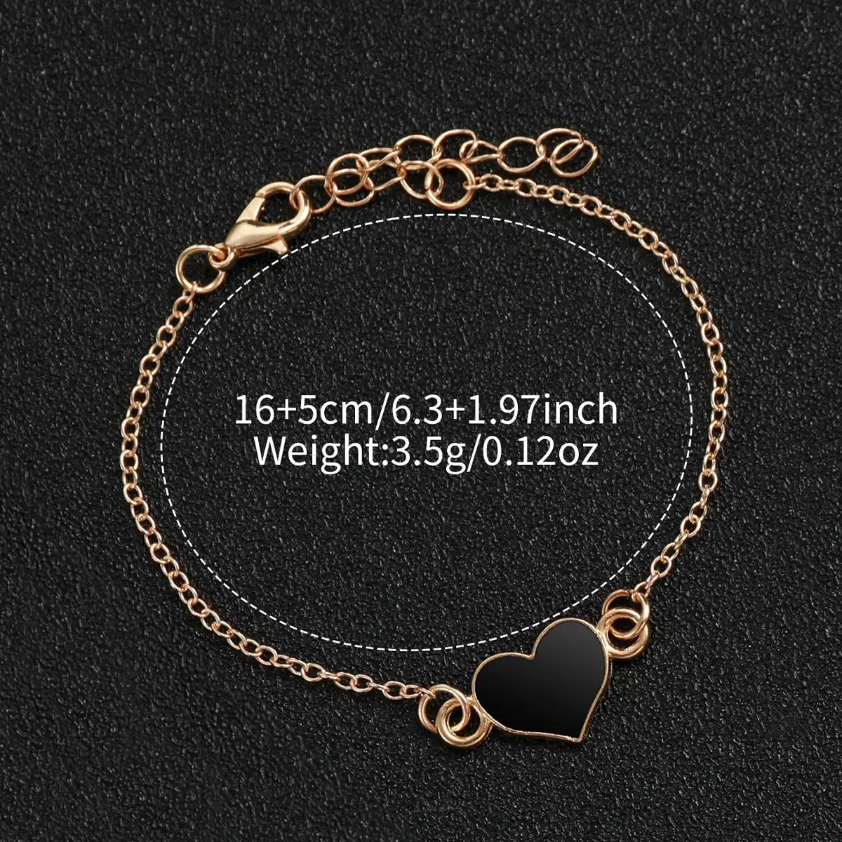 Rose-gold bracelet with black enamel heart charm and adjustable lobster clasp