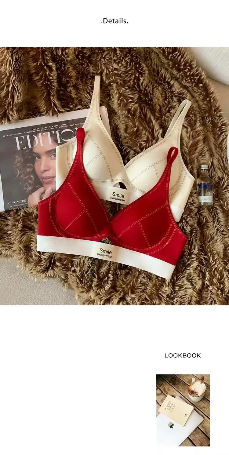 Two seamless women's bras, red and beige with white Smile Underwear bands; breathable daily lingerie.
