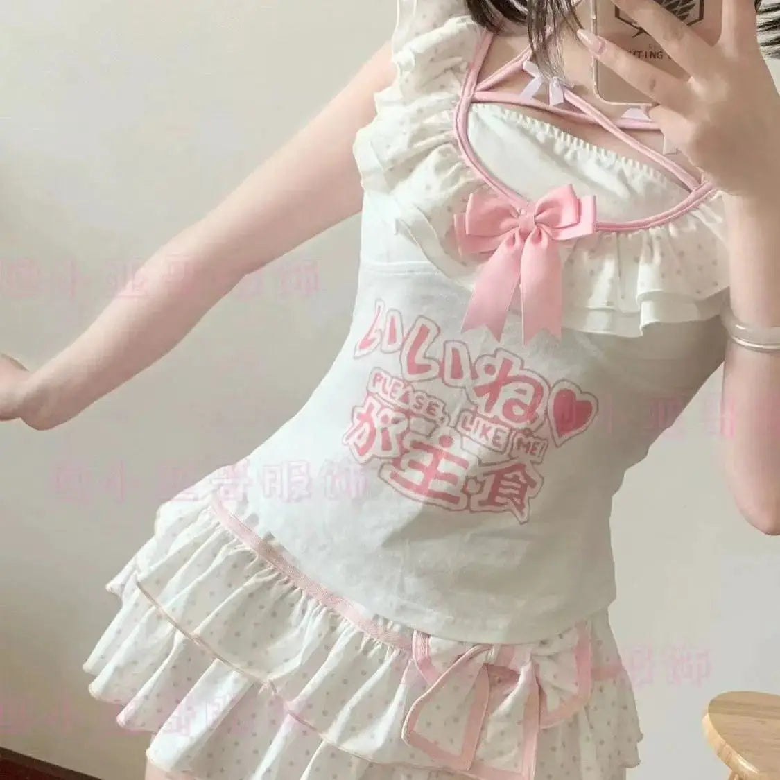 Harajuku Lolita style white top with pink bow and layered polka-dot ruffle skirt