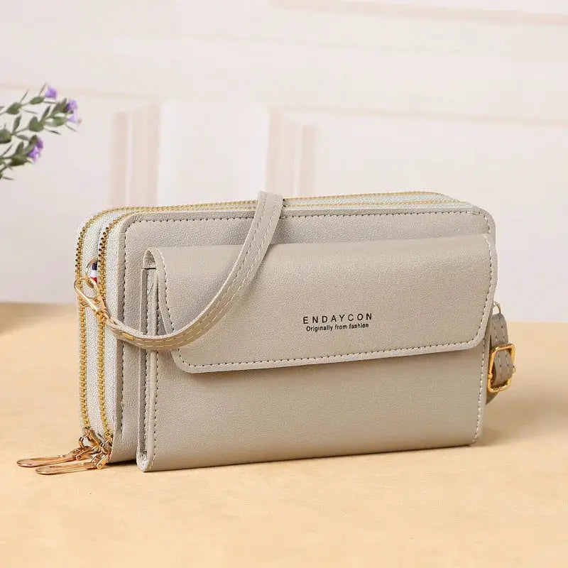 Endaycon gray crossbody bag with gold hardware and double zipper