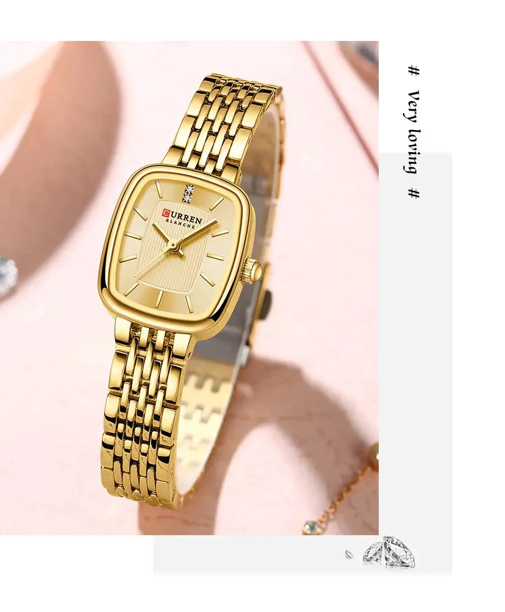 CURRN 9093 gold-tone women's quartz wristwatch with diamond markers on a gold steel bracelet.
