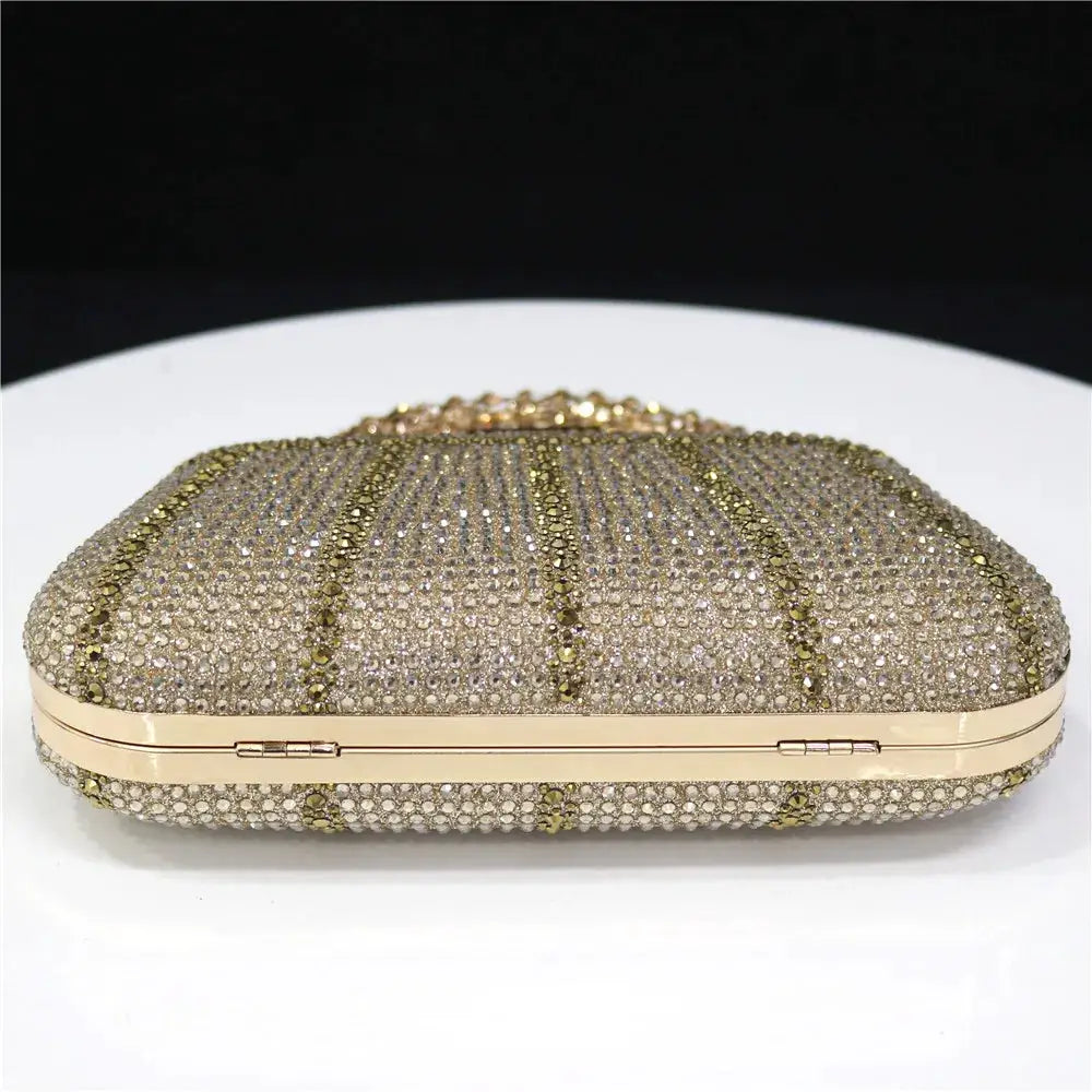 Rhinestone-embellished evening clutch with gold-tone frame and long chain