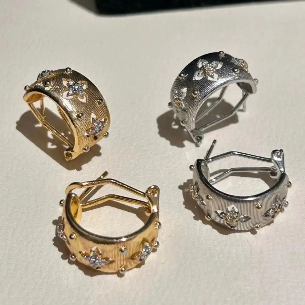 Flower-shaped hollow hoop earrings in gold-tone and silver-tone finishes with zircon accents (set of 4)