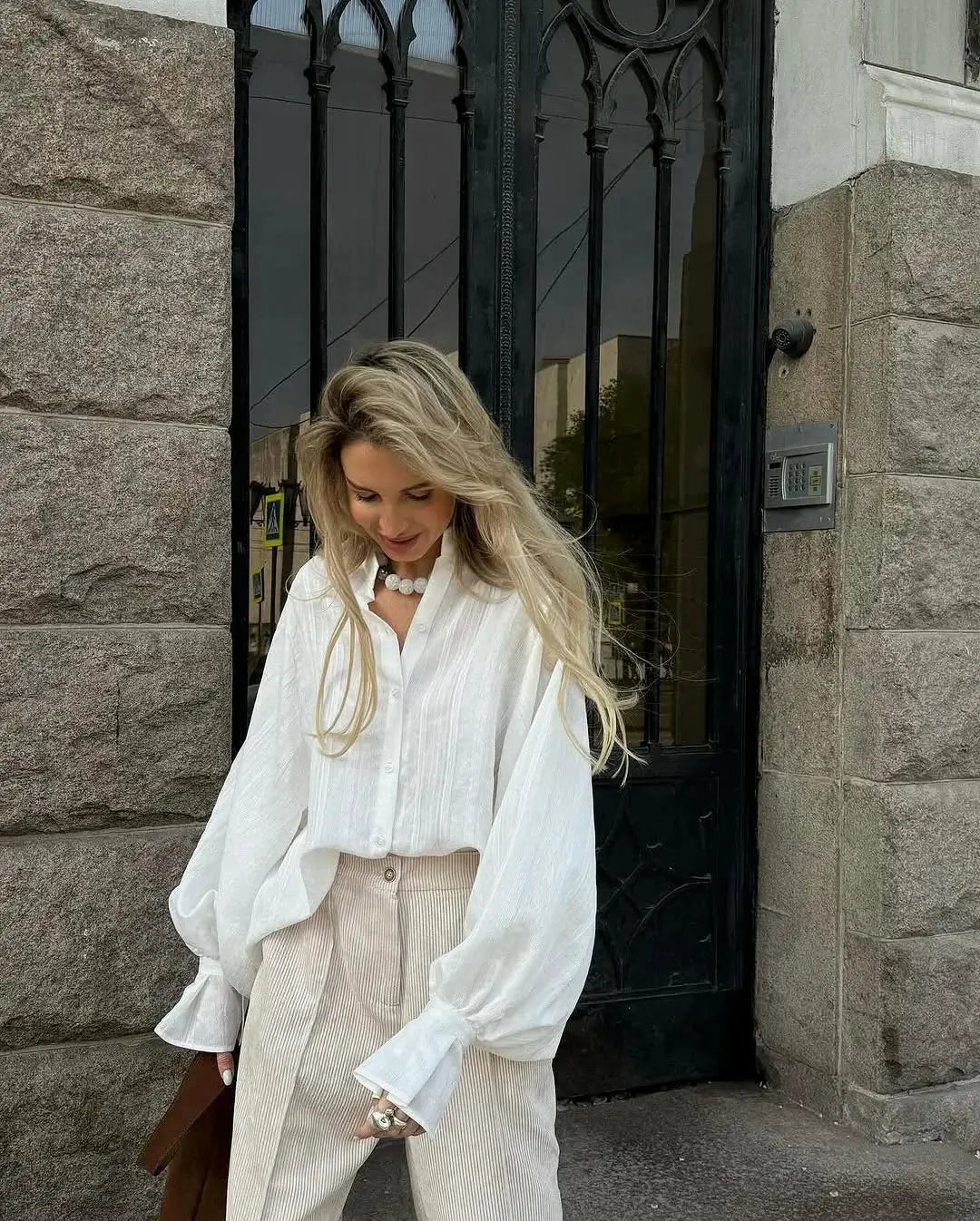 Women's oversized white 100% cotton button-up shirt with long sleeves, minimalist chic blouse