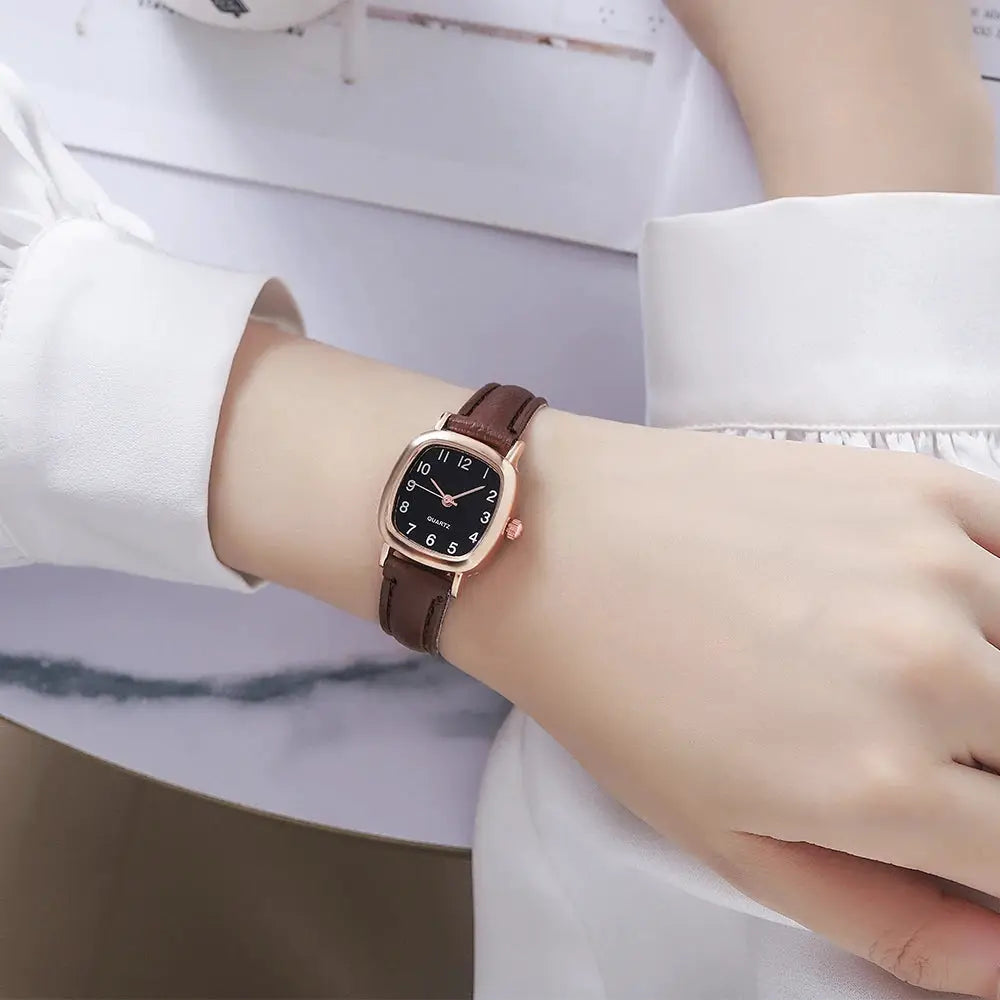 Women's watch with brown leather strap, rose-gold case, black dial and Arabic numerals