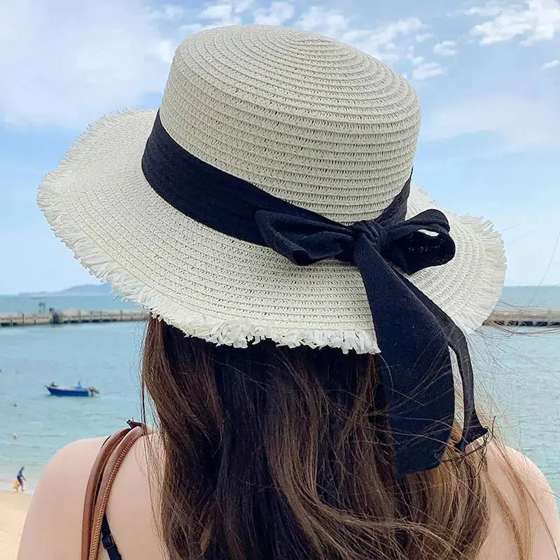 Korean bow straw hat for women, beige wide-brim beach hat with a black ribbon bow