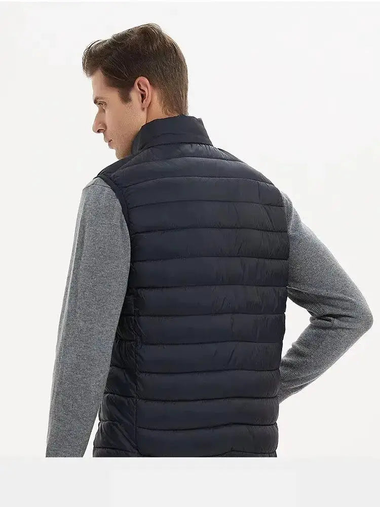 Men's navy quilted padded vest with stand collar.