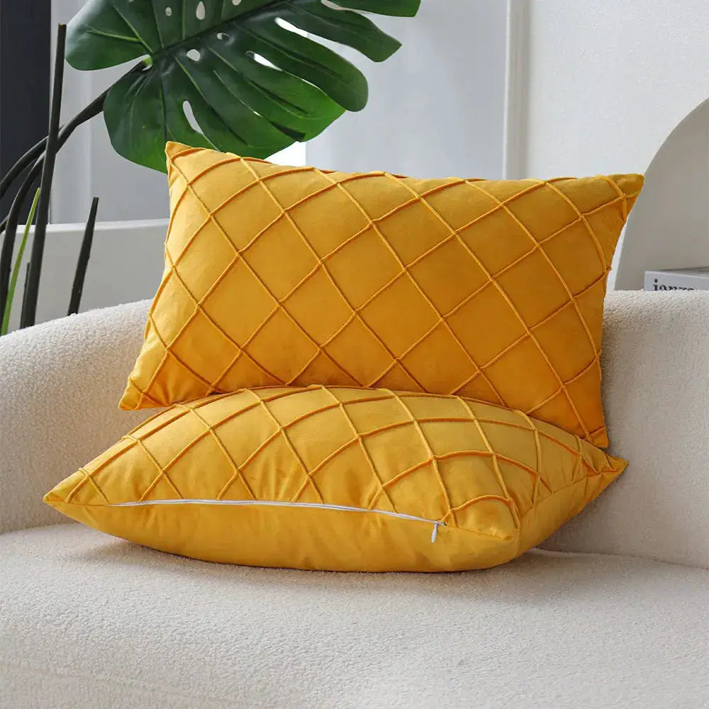 Two yellow quilted decorative pillow covers 30x50 by Simples Market on a beige sofa.