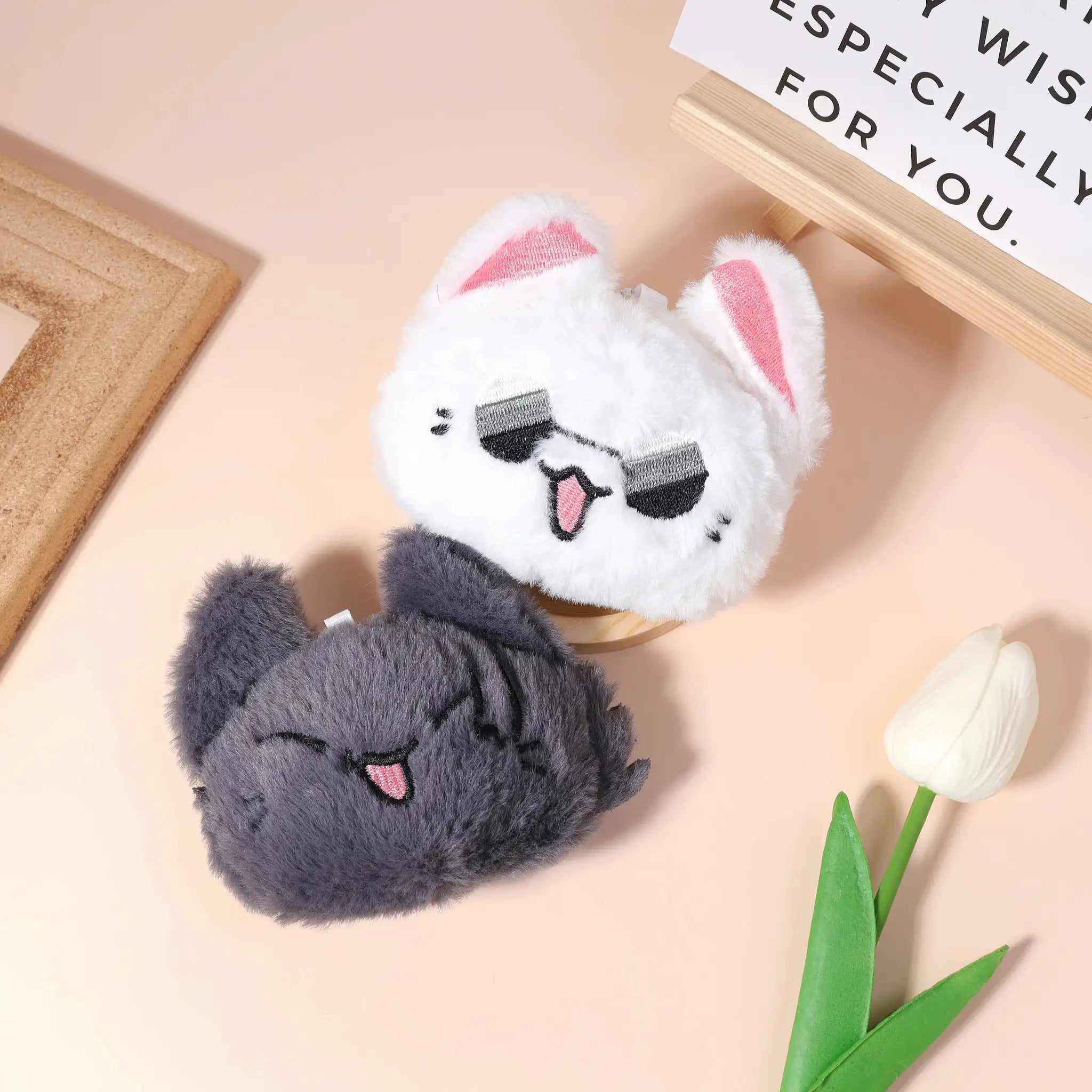 Fluffy plush cosplay keychain duo in white and gray with pink ears and soft fur