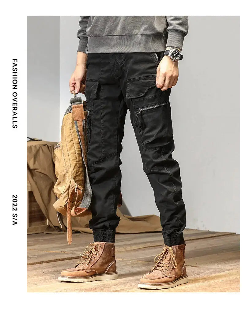 CAAYU cargo joggers in black with multiple pockets, zippered side pockets, and elastic cuffs