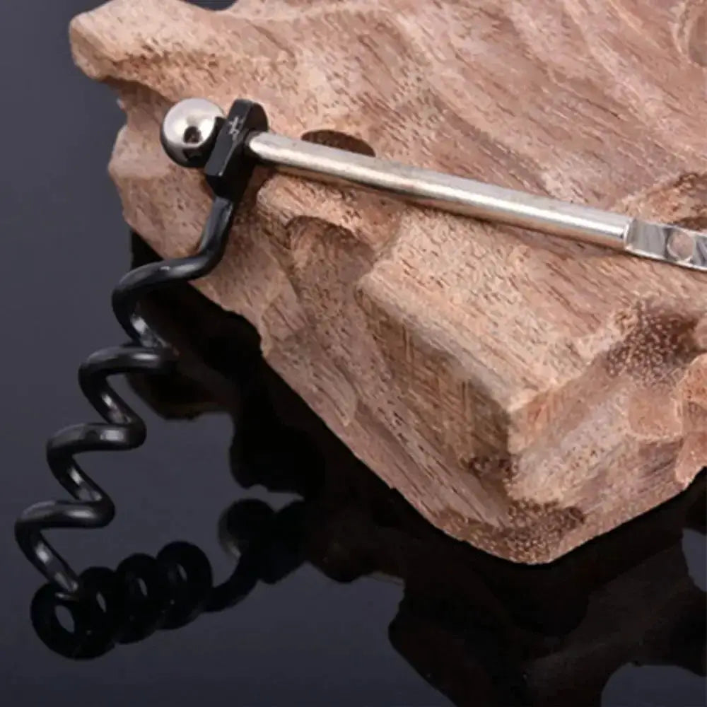 Bottle opener keyring tool with stainless steel corkscrew and black spiral, compact outdoor EDC camping gadget