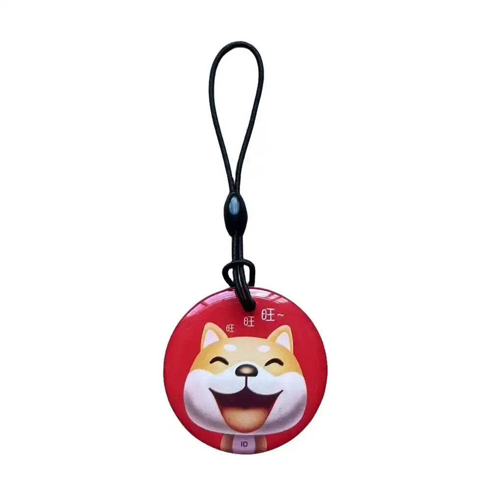 Round red RFID key tag with cartoon dog face on a black lanyard