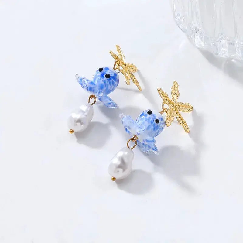 Glass octopus drop earrings in blue with gold starfish accents and dangling pearls (pair)