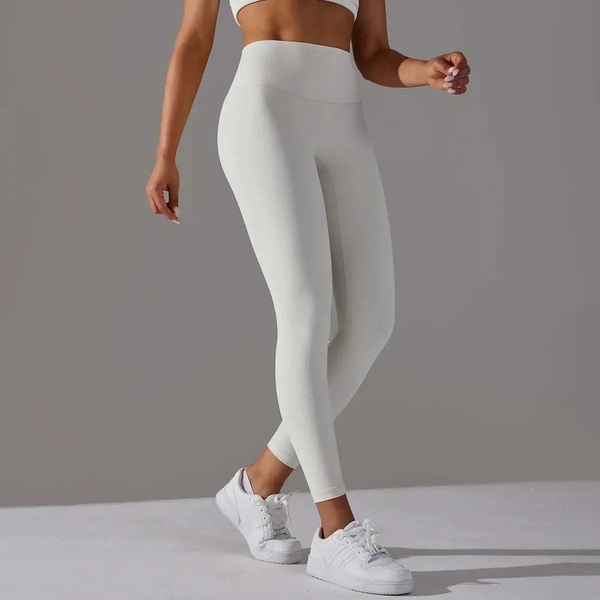 White high-waist leggings for women, ideal for fitness, running, yoga, and casual workouts; tight form-fitting pants.