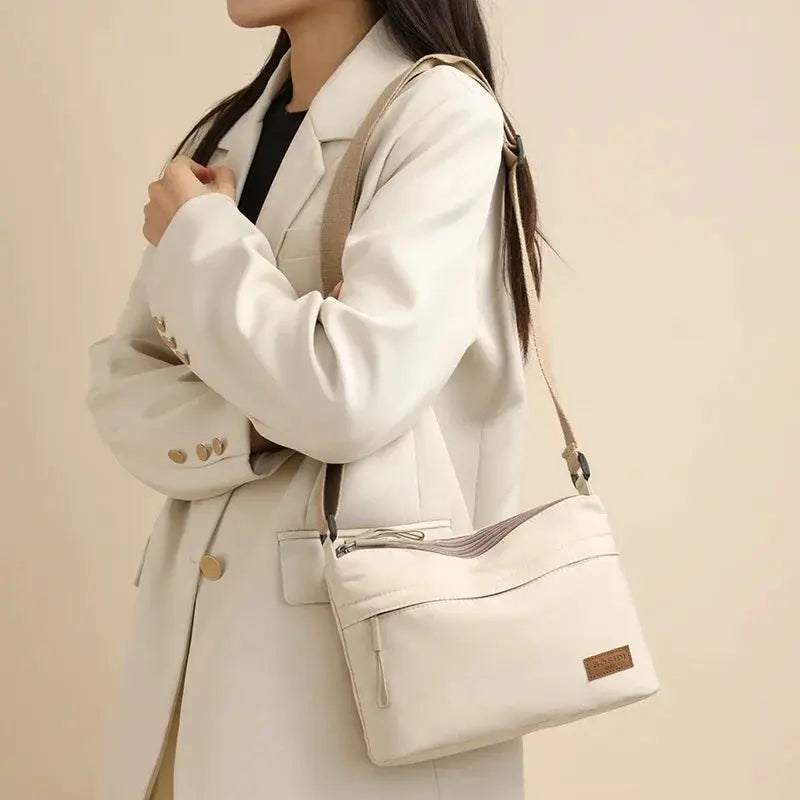 Simples Market cream canvas shoulder crossbody bag with three pockets and beige strap