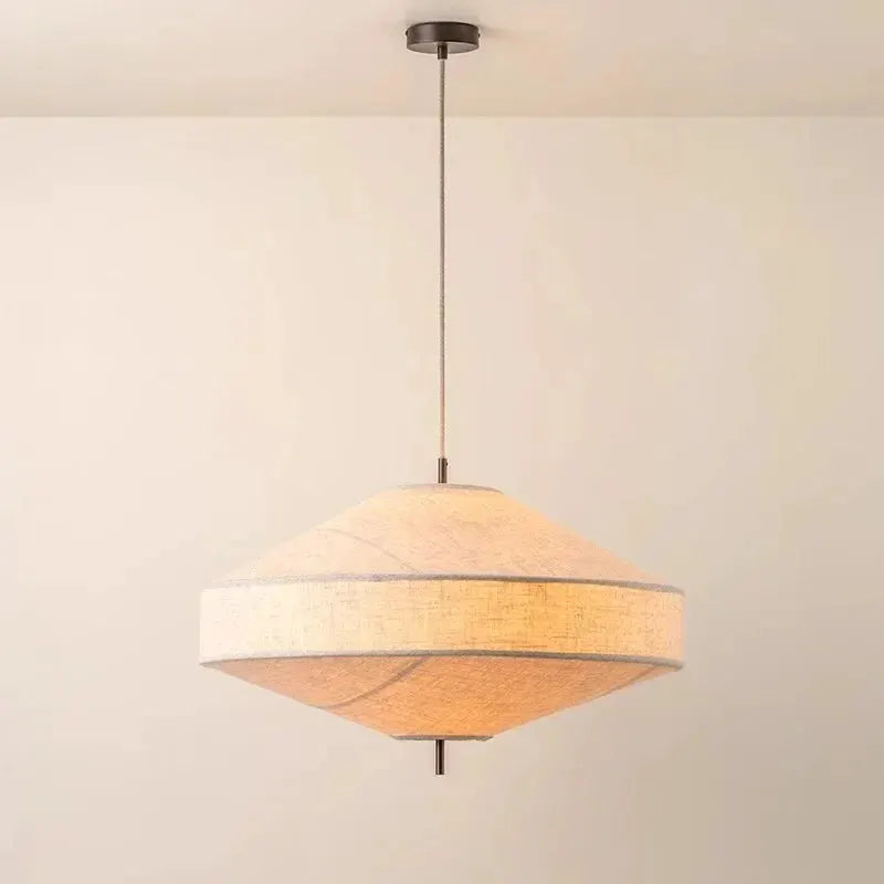 Fabric pendant light with beige woven shade in a diamond shape, rustic wabi-sabi style.