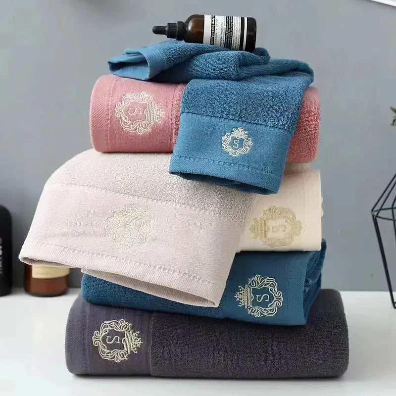 5-piece cotton towel set with embroidered crest logos in assorted colors