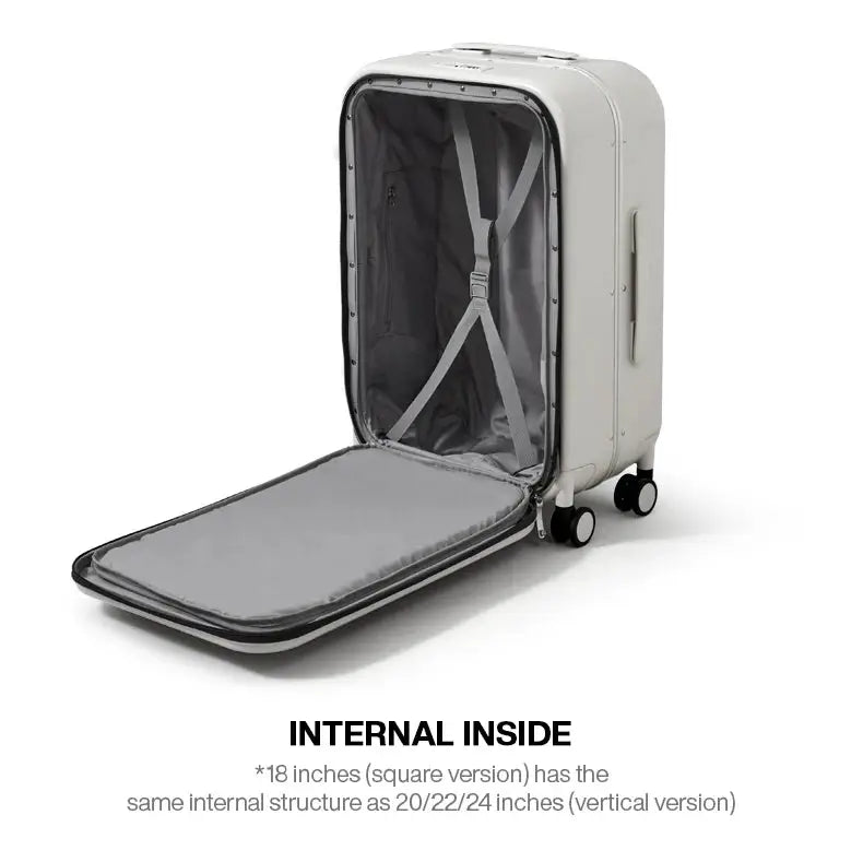 Mixi aluminum-frame carry-on suitcase by Simples Market, cream exterior with gray interior and cross-strap system