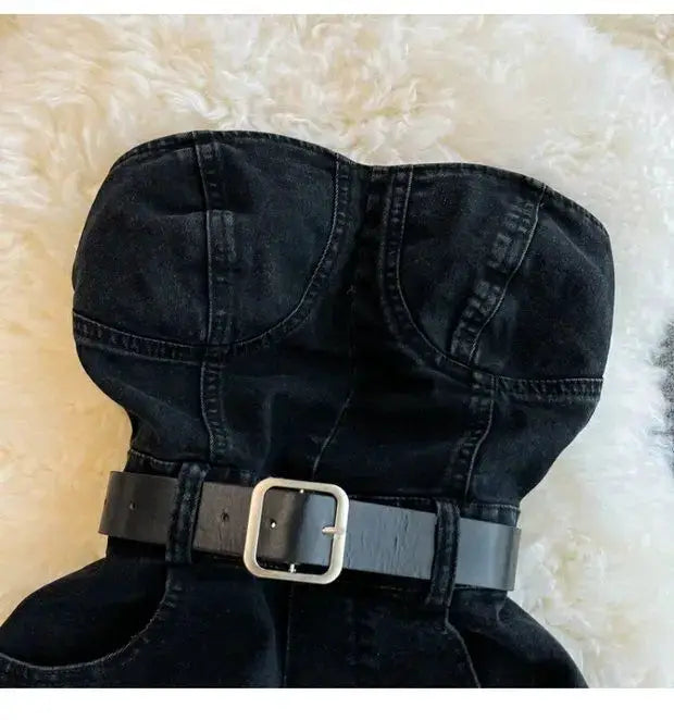 Black denim strapless romper with a wide waist belt and silver buckle