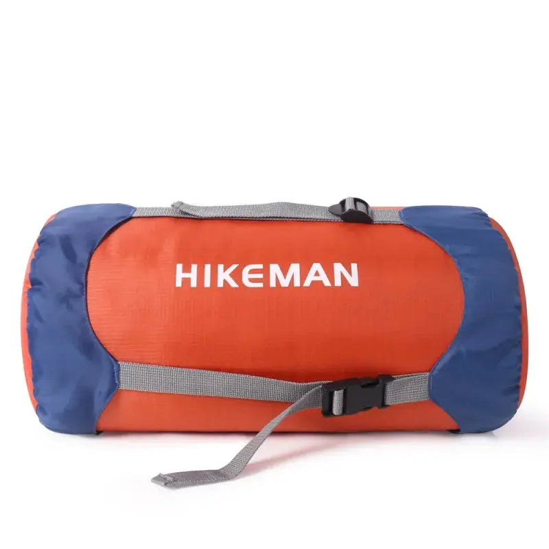 Sleeping bag compression bag HIKEMAN in orange with blue ends, gray straps for portable waterproof camping storage