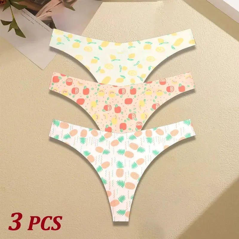 Three-piece women's seamless thong set with fruit-print patterns in yellow, pink, and white