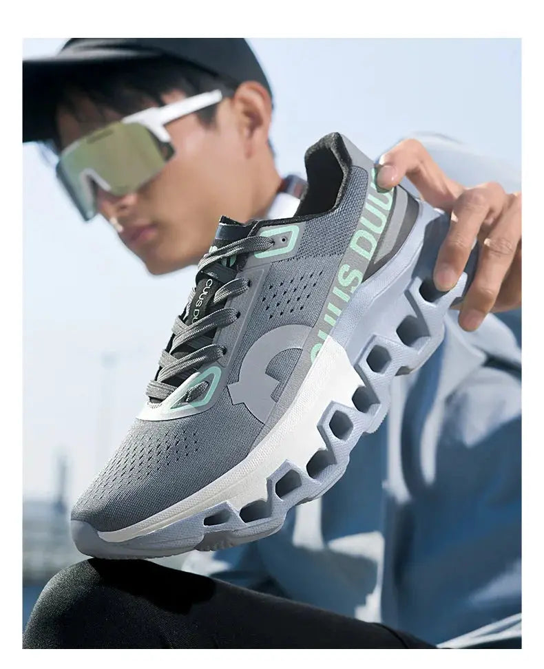 Men's off-road running shoe by Simples Market, gray breathable mesh with teal accents and a cushioned sole.
