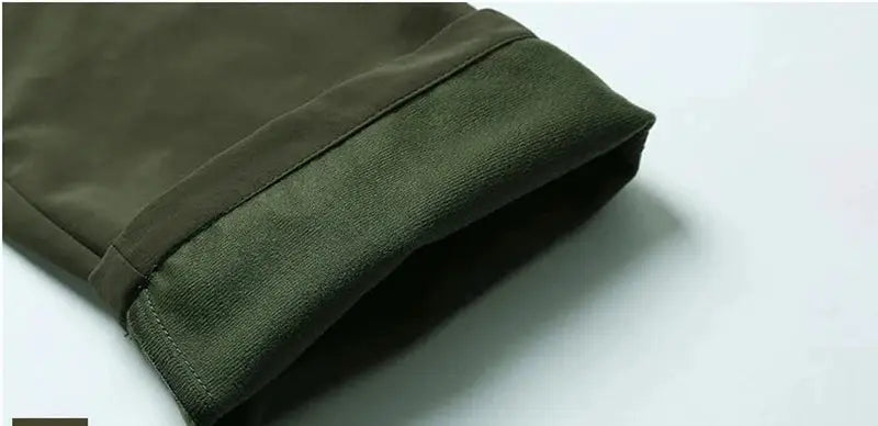 Olive green outdoor work tactical pants with fleece-lined interior, cargo style