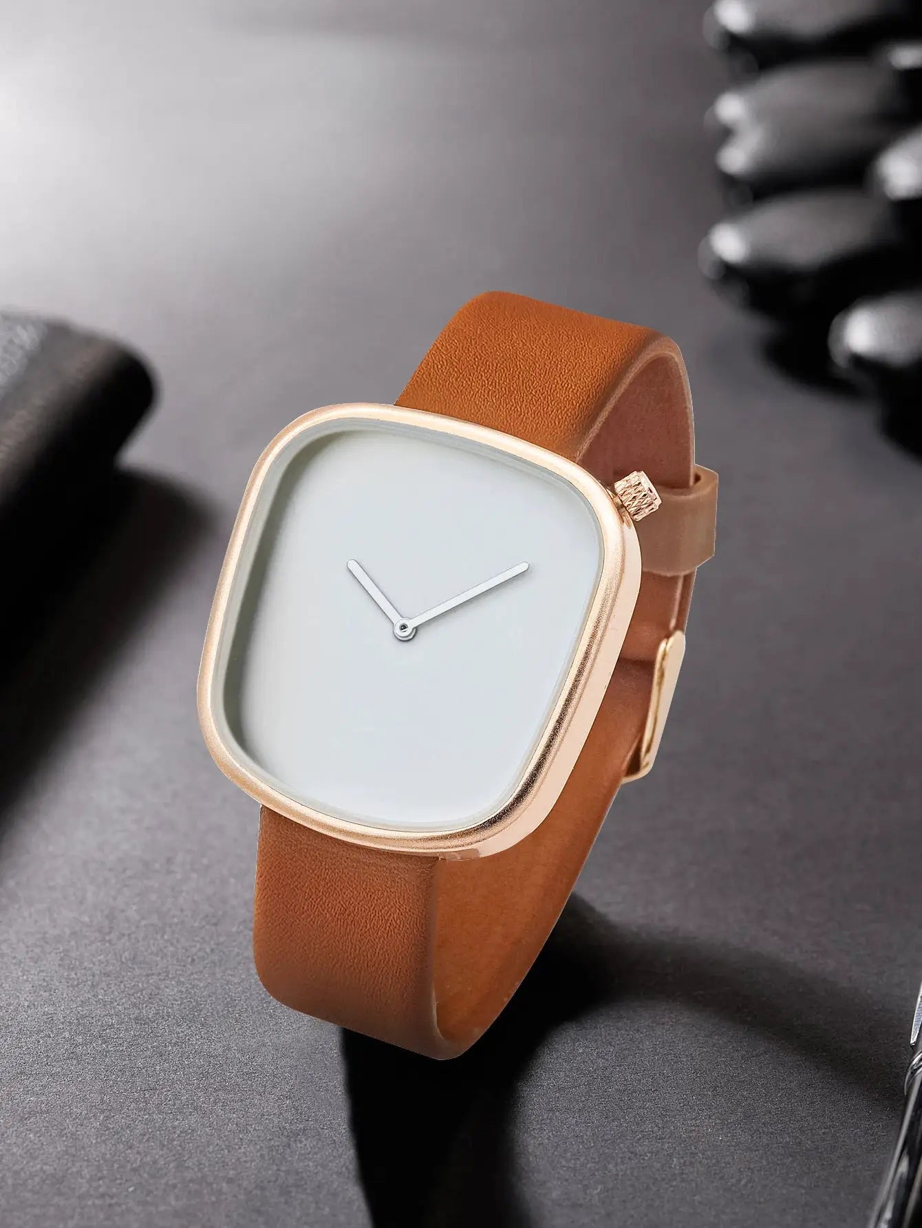 TOMI minimalist square quartz watch with tan leather strap and gold-tone case.