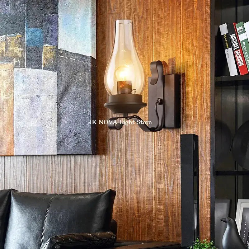 Simples Market wall lamp, industrial wrought-iron with glass shade, mounted on wood panel.